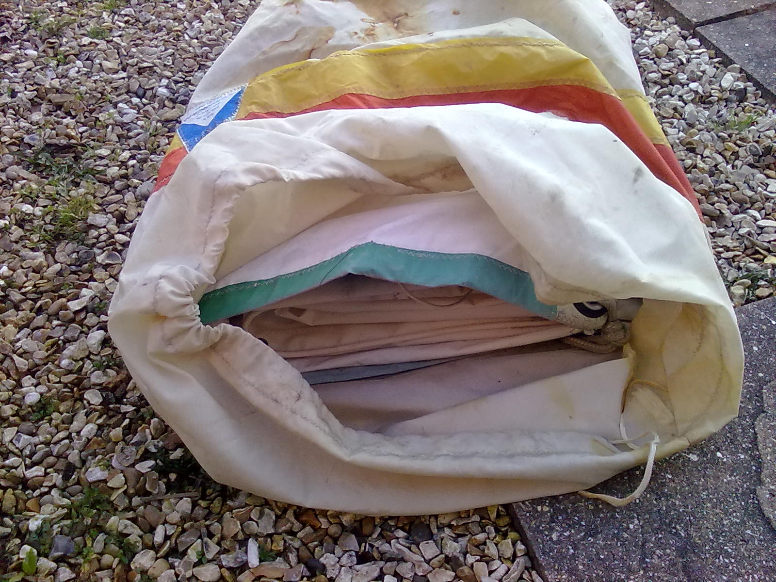 all bagged up in original sail bag, (bit of a rust stain)