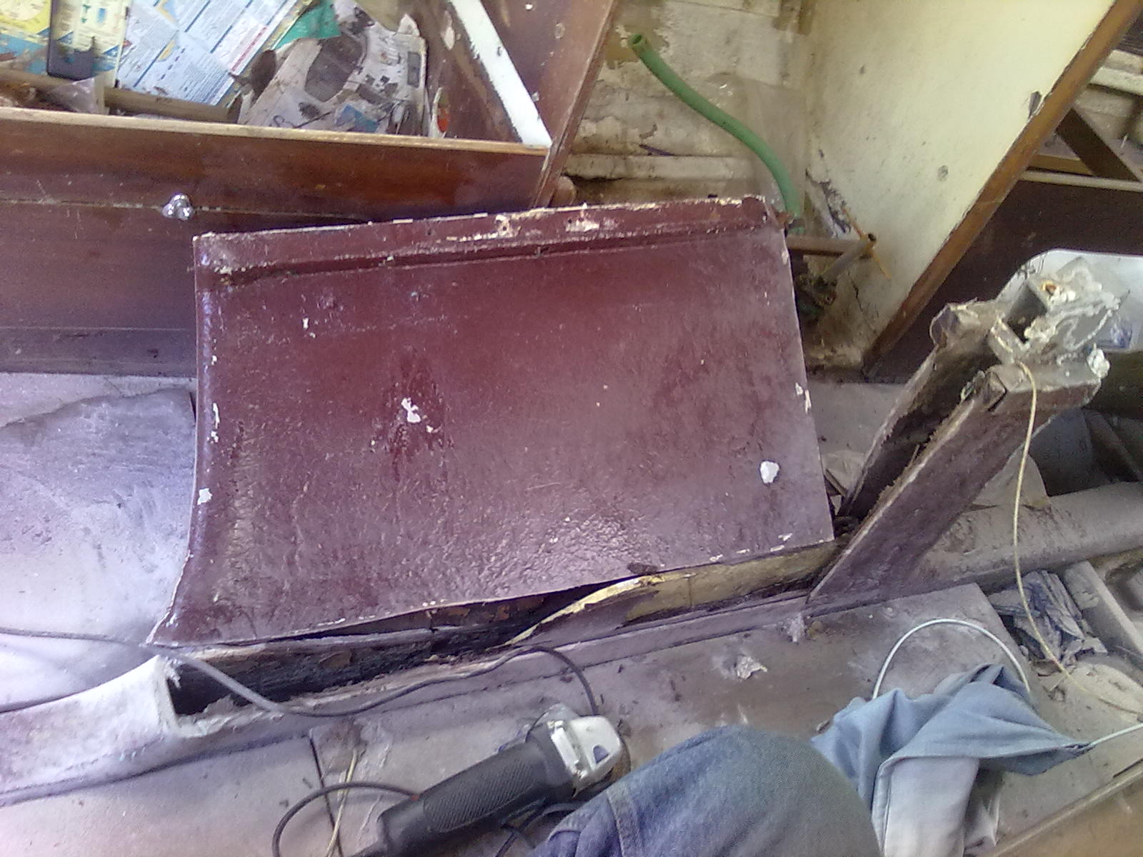 i detroyed case to get board out, but its easily installed from under with boat  lifted, i lso have the steel roller and  strut that was glassed into fore end of caing and mechanisms